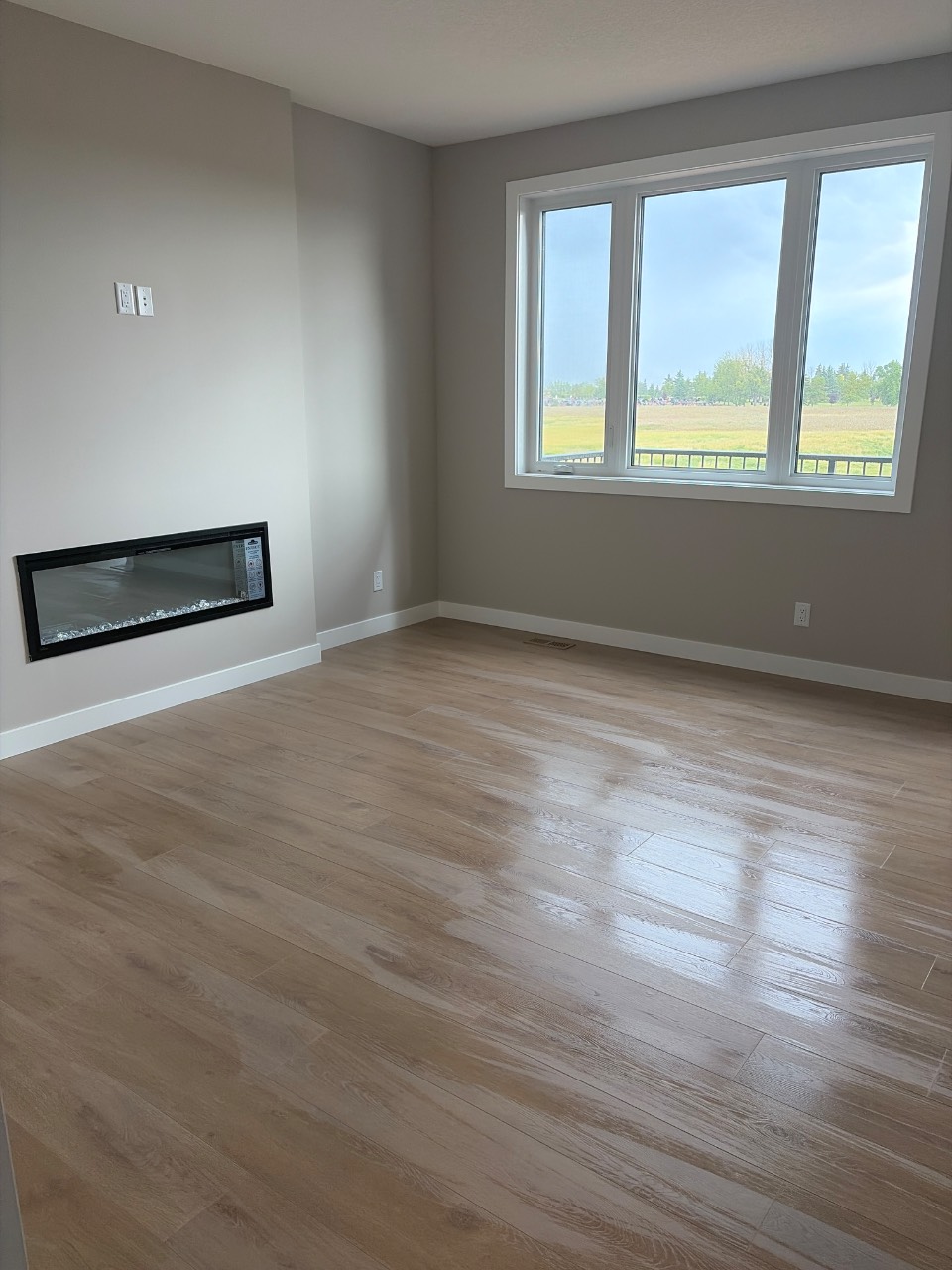 A living room with floor-to-ceiling windows after cleaning